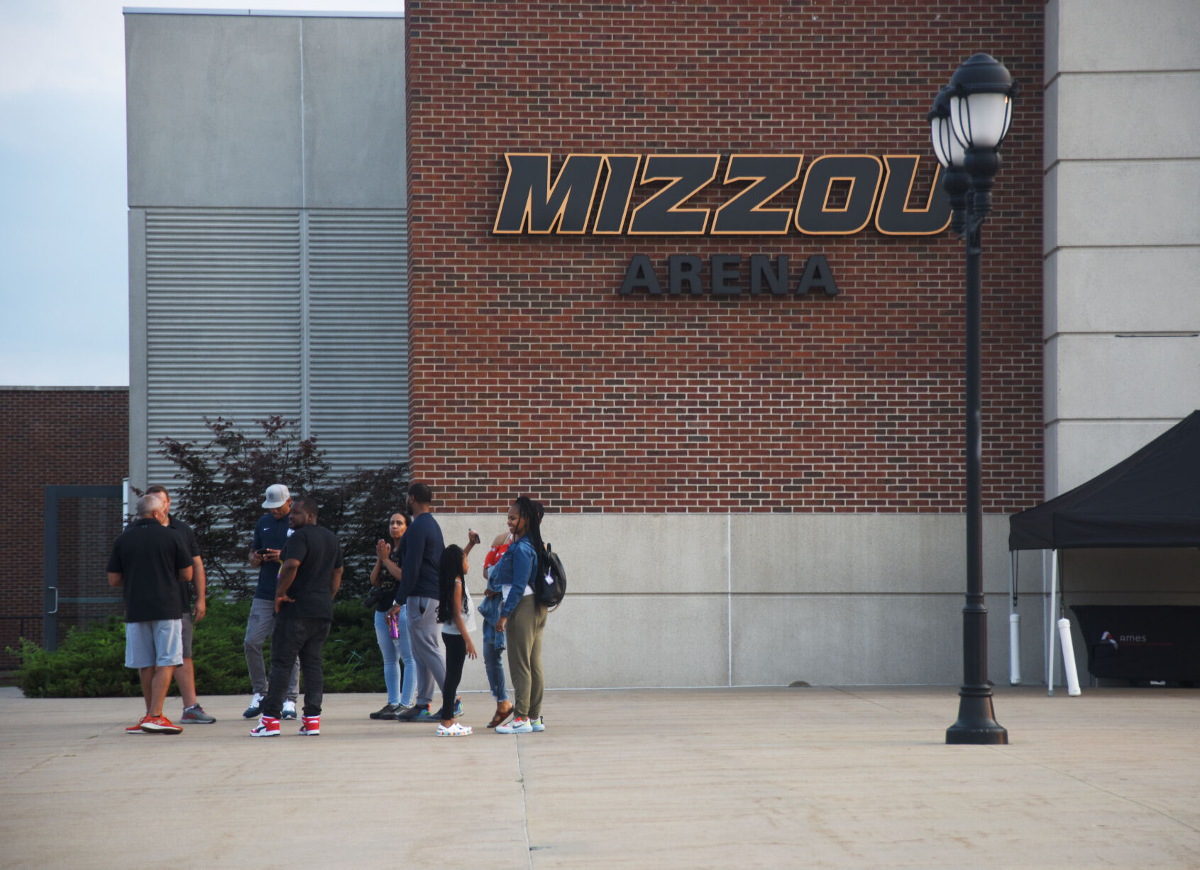 Athletes and their families gather outside the Mizzou Arena after the ceremony